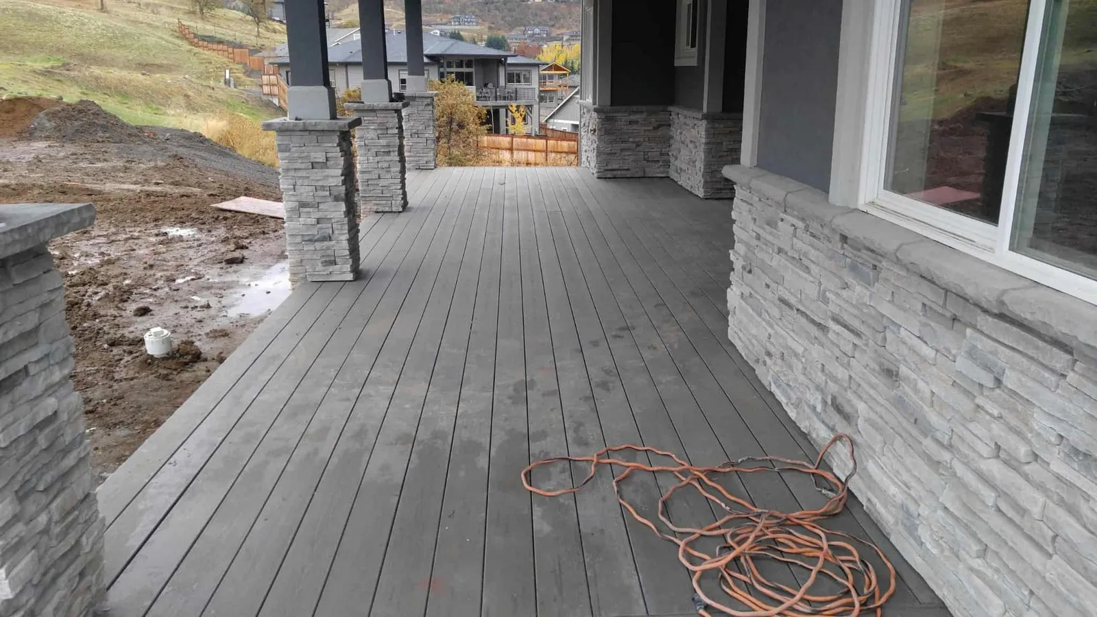 Stone veneer wainscot and lap siding combination on a Medford Oregon home by Next Gen Contracting